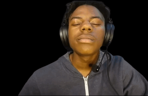 A Young Man Wearing Headphones And A Microphone Making A Funny Face GIF