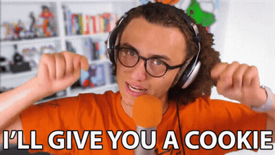 A Young Man Wearing Headphones And Glasses Says I 'Ll Give You A Cookie GIF