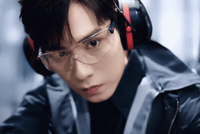A Young Man Wearing Headphones And Safety Goggles GIF