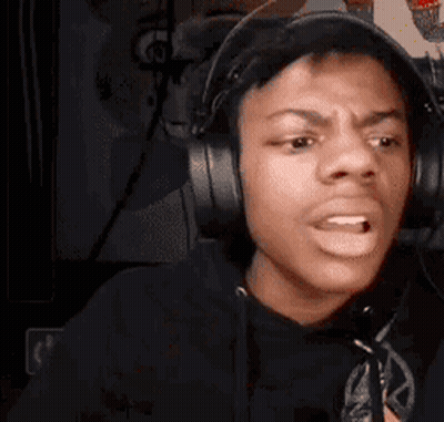 A Young Man Wearing Headphones Is Making A Funny Face . GIF