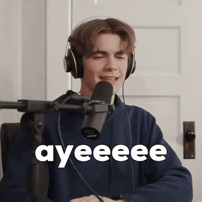A Young Man Wearing Headphones Is Singing Into A Microphone And The Word Ayeeee Is On The Screen Behind Him GIF