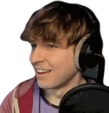 A Young Man Wearing Headphones Is Smiling And Talking Into A Microphone . Sticker
