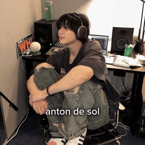 Young Man With Headphones Sitting At Desk With Take A Whi Sign GIF