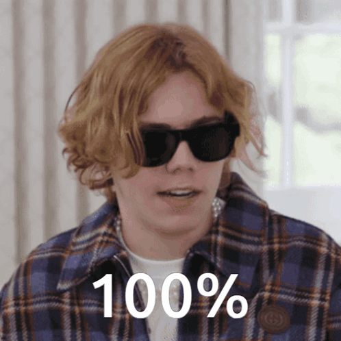 A Young Man Wearing Sunglasses Says 100 % GIF