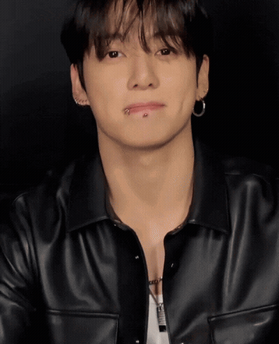 A Young Man With A Piercing In His Lip Is Wearing A Black Jacket GIF