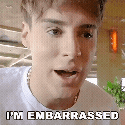 A Young Man With A Surprised Look On His Face And The Words I 'M Embarrassed Written Below Him GIF