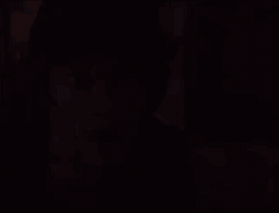 A Young Man With A Surprised Look On His Face Is Looking At The Camera . GIF