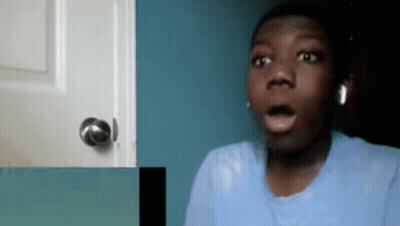 A Young Man With A Surprised Look On His Face Is Wearing Headphones GIF