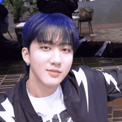 A Young Man With Blue Hair And A Lightning Bolt Jacket GIF