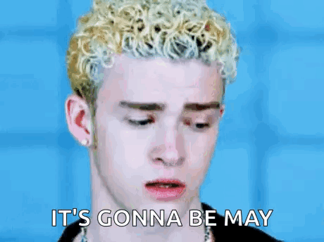 A Young Man With Curly Blonde Hair Is Saying It 'S Gonna Be May GIF