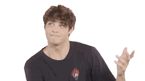 A Young Man With Curly Hair Is Wearing A Black T-Shirt With A Flaming Heart On The Front Sticker