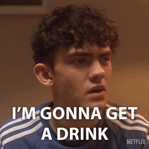 A Young Man With Curly Hair Says I 'M Gonna Get A Drink GIF