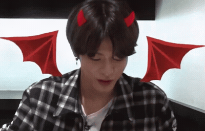 A Young Man With Devil Horns And Wings On His Head GIF