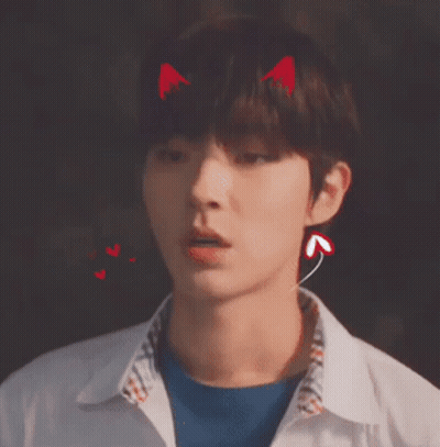 A Young Man With Devil Horns On His Head Wearing Ear Buds . GIF