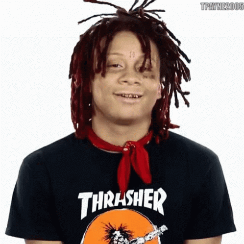 A Young Man With Dreadlocks Is Wearing A Thrasher Shirt GIF