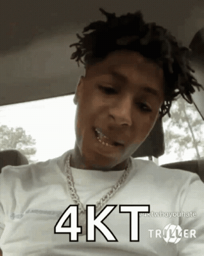 A Young Man With Dreadlocks Is Wearing A White Shirt And A Chain Around His Neck And Says 4Kt GIF