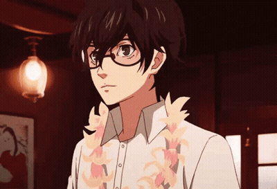 A Young Man With Glasses And A Lei Around His Neck Is Standing In A Dark Room . GIF