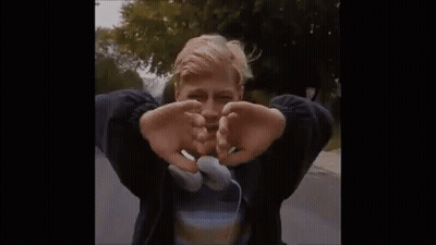 A Young Man With Headphones Around His Neck Is Crying . GIF