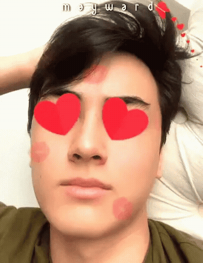 A Young Man With Hearts In His Eyes And The Name Mary Ward Written On His Forehead GIF