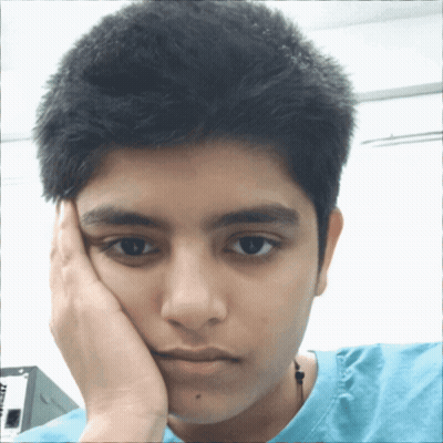 A Young Man With His Hand On His Face Is Wearing A Blue T-Shirt That Says ' At & T ' On It GIF