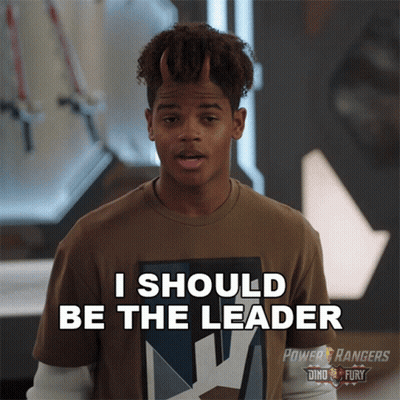 A Young Man With Horns On His Head Is Wearing A Power Rangers Shirt GIF