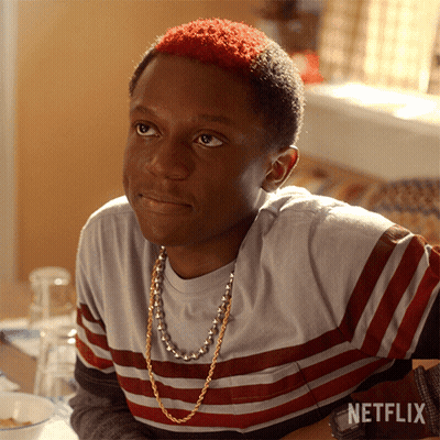 A Young Man With Red Hair Is Sitting At A Table With A Netflix Logo On The Bottom GIF