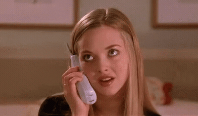 A Young Woman Is Talking On A Cell Phone And Making A Funny Face . GIF