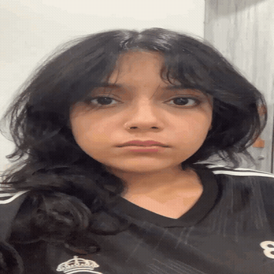 A Young Woman Wearing A Black Shirt With The Number 8 On It GIF