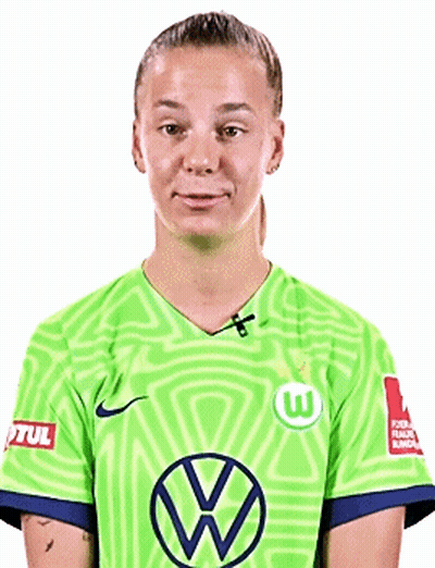 A Young Woman Wearing A Green Soccer Jersey With A Vw Logo On It . GIF