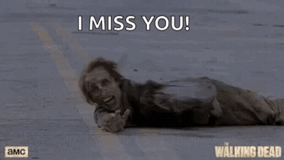 A Zombie Is Laying On The Ground With The Words `` I Miss You '' Written Above Him . GIF