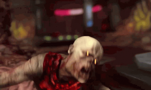 A Zombie With Blood Coming Out Of His Mouth Is Laying On The Ground . GIF