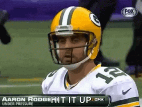 Aaron Rodgers Is Wearing A Yellow Helmet And A Green Bay Packers Jersey . GIF