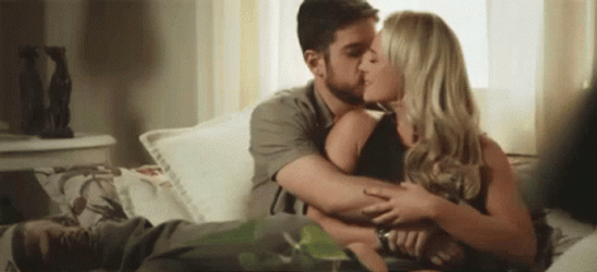 Abrazo Couple On A Couch  GIF