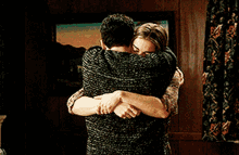 Abrazos Couple Hugging Tightly GIF
