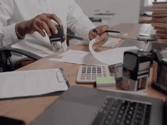 Accountant Stamping Papers GIF