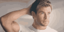 Actor Chris Hemsworth Patting His Head GIF