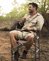 Actor Chris Hemsworth Sitting In The Forest GIF