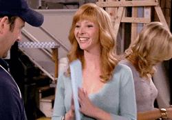 Actress Lisa Kudrow Bow With Paper In Hands GIF