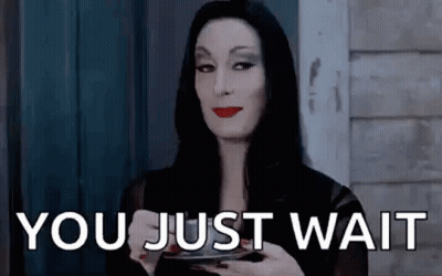 Addams Family Holding Coffee Saying You Just Wait GIF