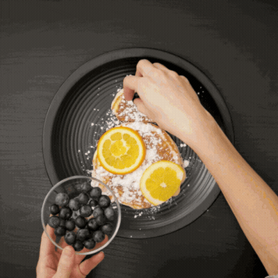 Adding Powdered Sugar To Blueberry Lemon Pancake GIF