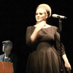 Adele Performing Shoulder Brush GIF