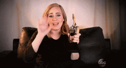 Adele Waving Hi While Holding Trophy GIF