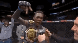 Adesanya Wearing Belt On His Shoulder GIF