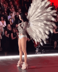 Adriana Lima Using Peacock Feathers GIF