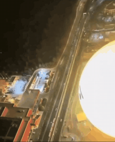 Aerial City At Night With Large Light GIF