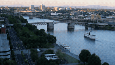 Aerial City With Bridge Over River GIF