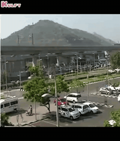 Aerial Parking Lot With Cars And Mountain GIF