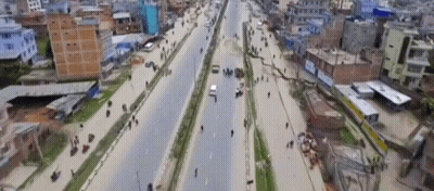 Aerial View Busy City Street TNT Sign GIF