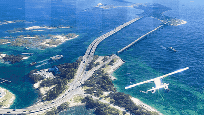 Aerial View Of Bridge Over Water With Plane GIF