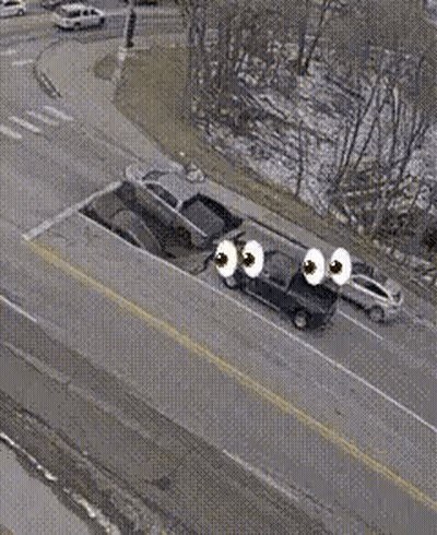 Aerial View Of Car Stuck In Road Hole GIF